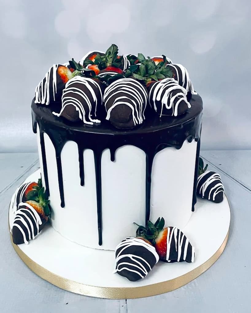Custom celebration cake featuring chocolate-covered strawberries by Sweet Cakes by Kristen