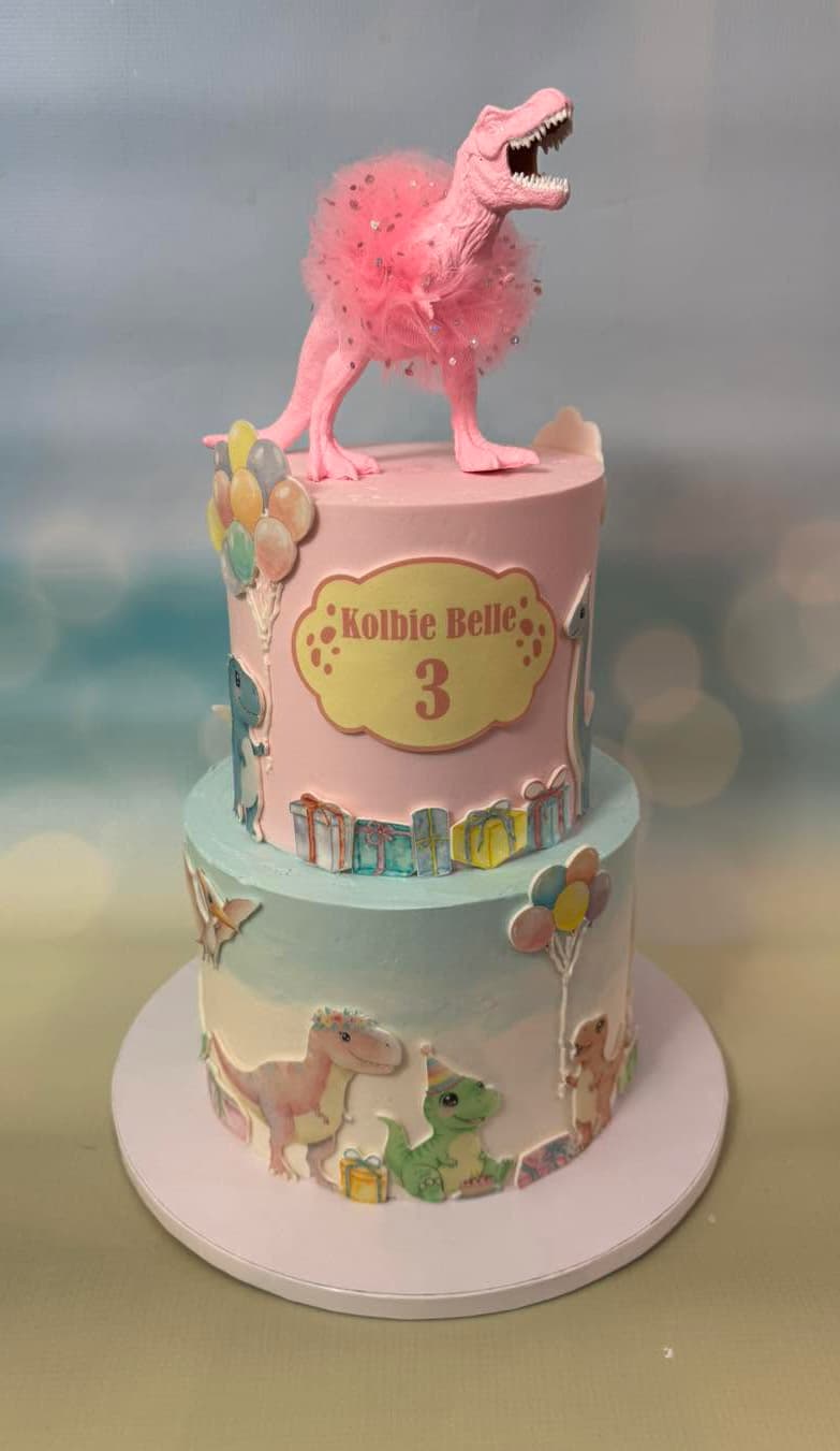 Custom dinosaur-themed birthday cake by Sweet Cakes by Kristen