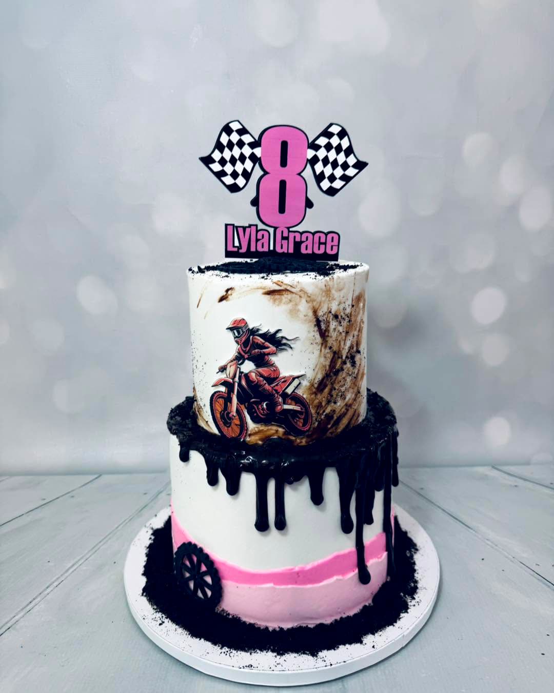 Custom dirt bike-themed birthday cake for a girl by Sweet Cakes by Kristen