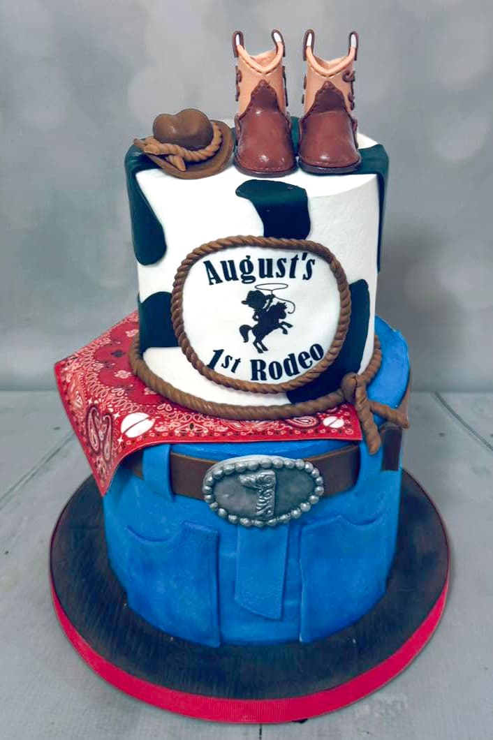 First rodeo cowboy birthday cake with western details and cowboy boots by Sweet Cakes by Kristen