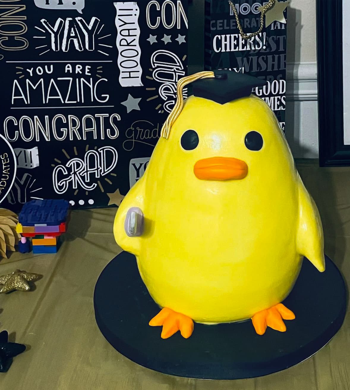 Creative sculpted duck with knife cake by Sweet Cakes by Kristen