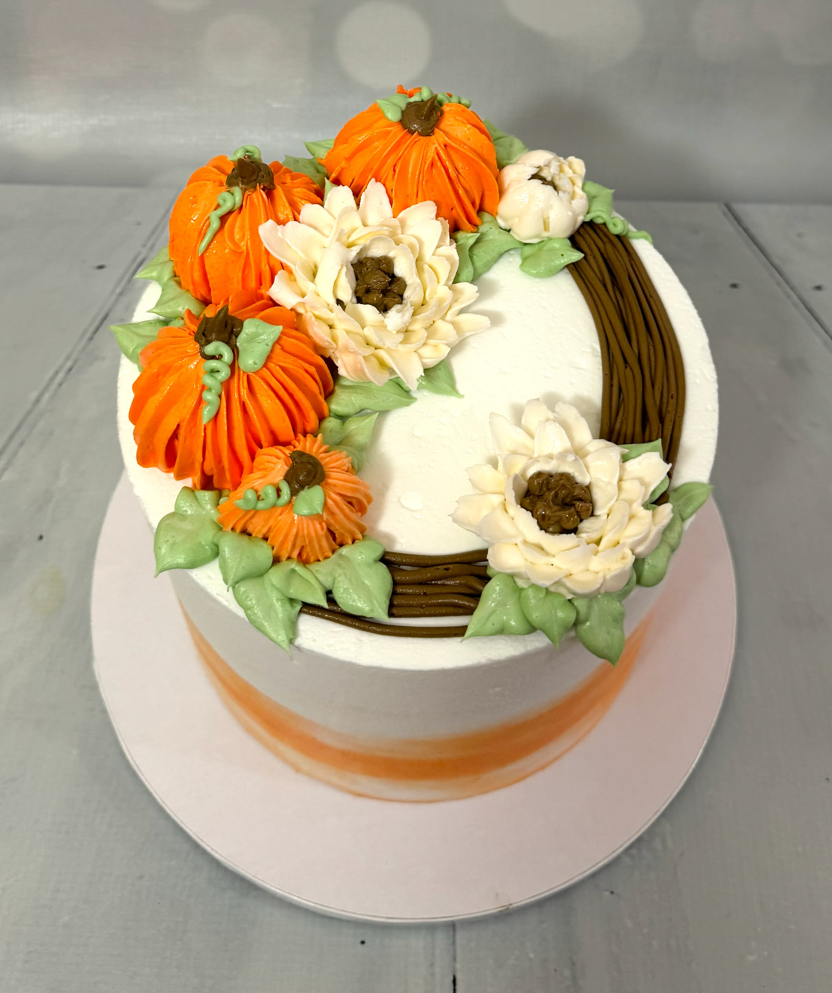 Realistic three-dimensional sculpted pumpkin cake by Sweet Cakes by Kristen