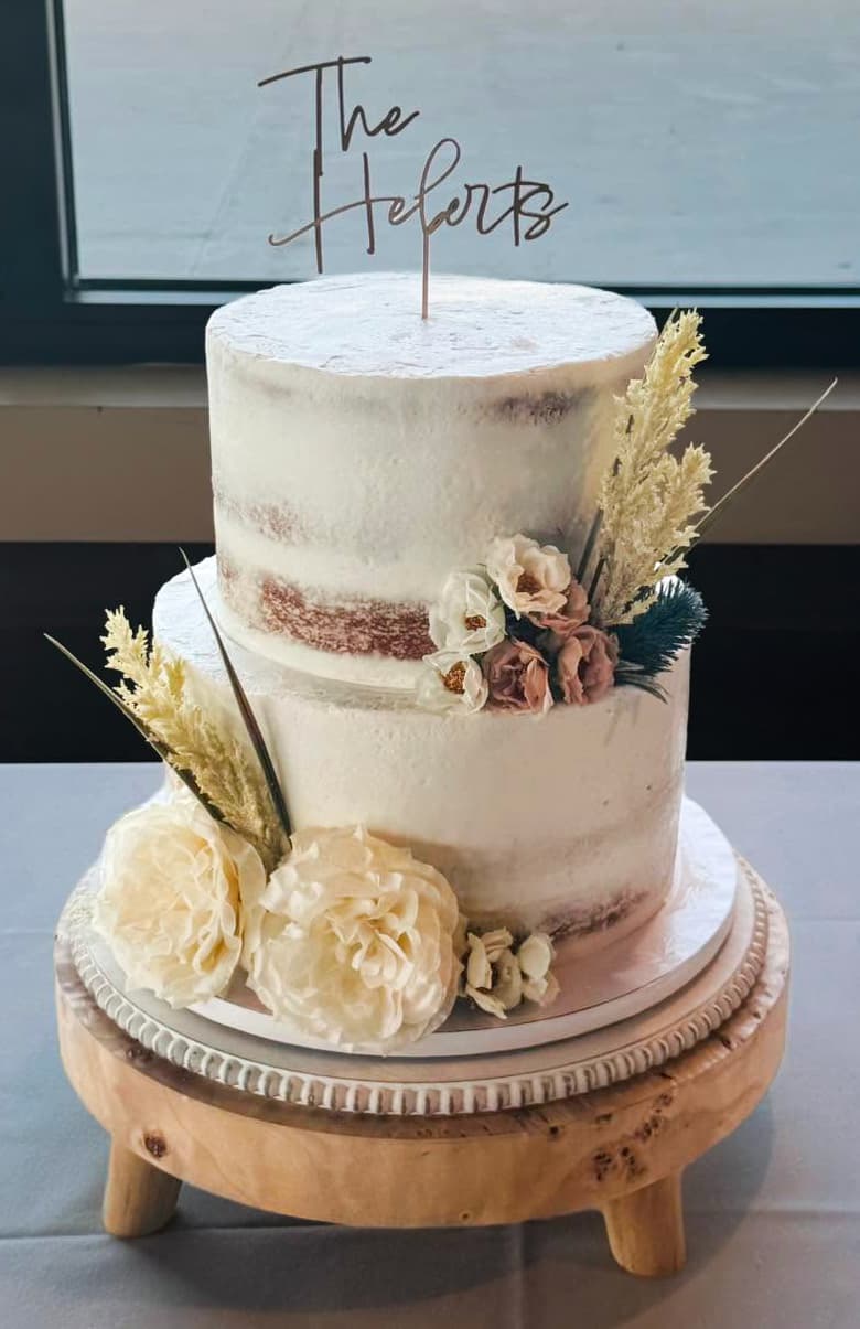 Rustic semi-naked wedding cake with textured buttercream and natural decorative details by Sweet Cakes by Kristen